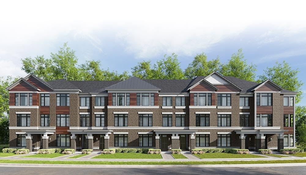 New modern townhouses with brick facade and gabled roofs.