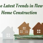 Cardboard house cutouts on green files, home construction trends.